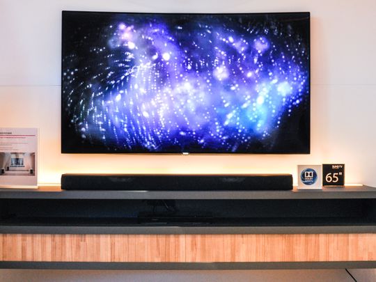 For scale, the Samsung soundbar is positioned beneath